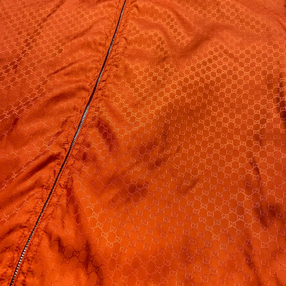 Gucci orange monogram puffer jacket