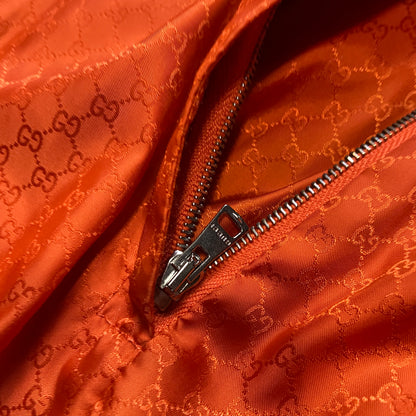 Gucci orange monogram puffer jacket